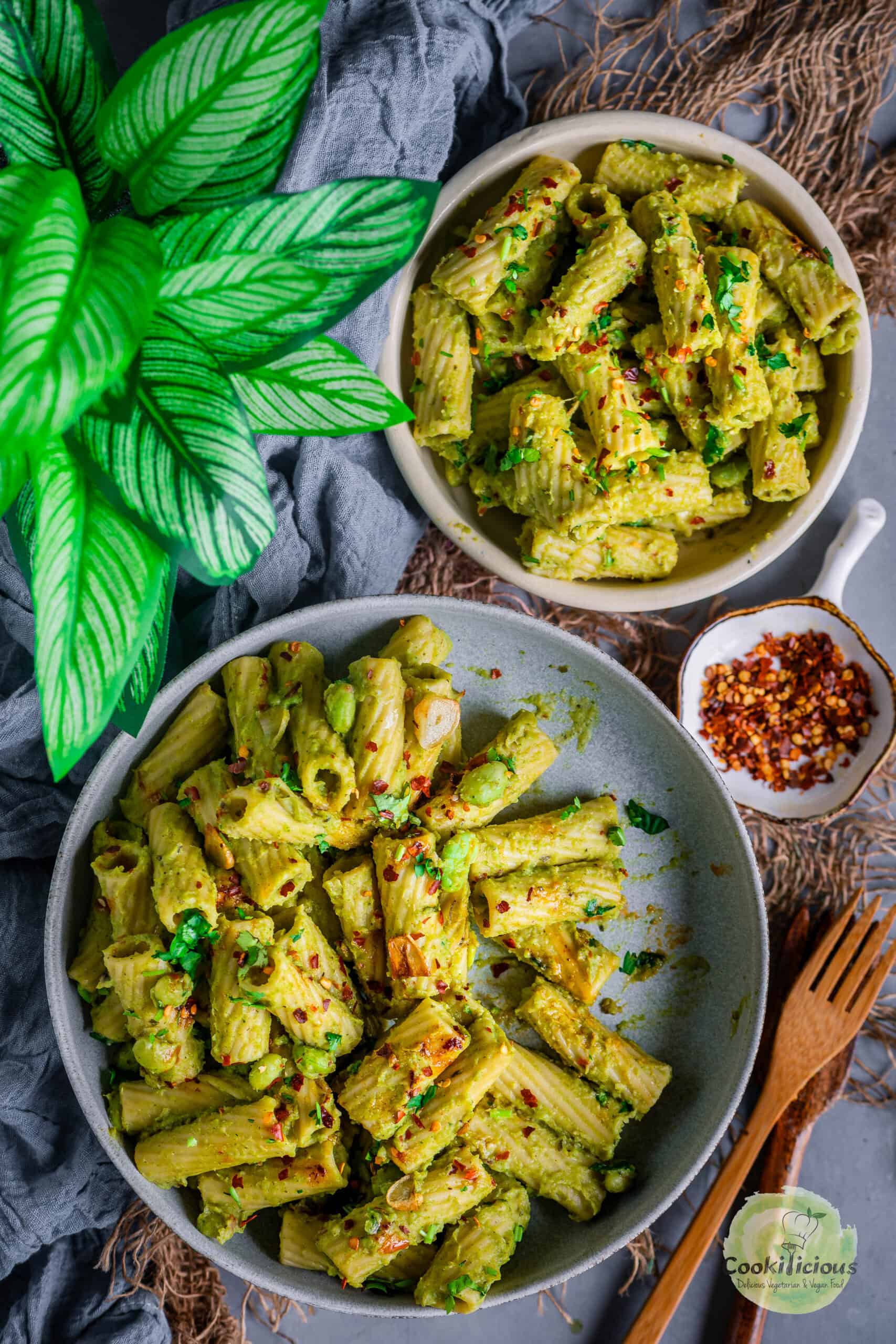 2 bowls of plant-based pasta with broccoli sauce.