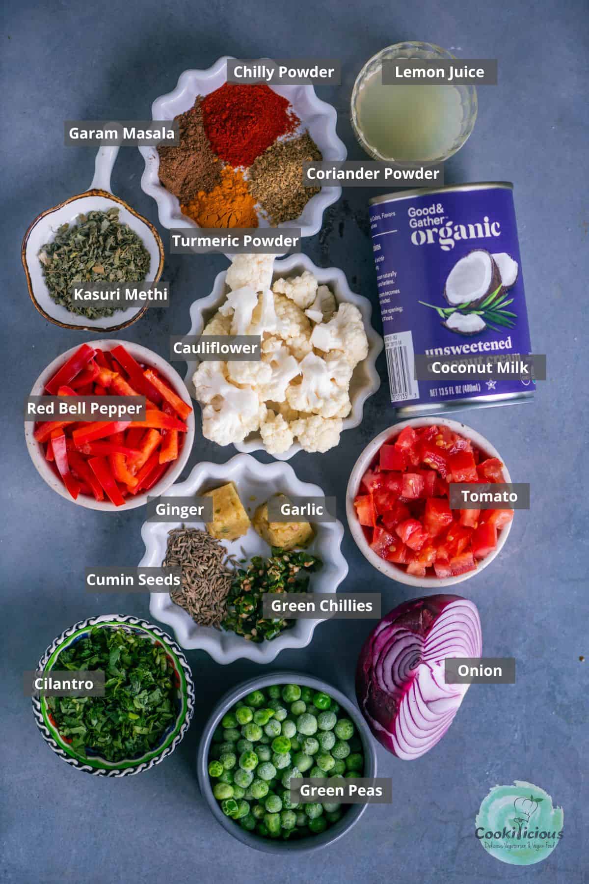 all ingredients needed to make easy Vegan Cauliflower Tikka Masala placed on a table with labels on them.