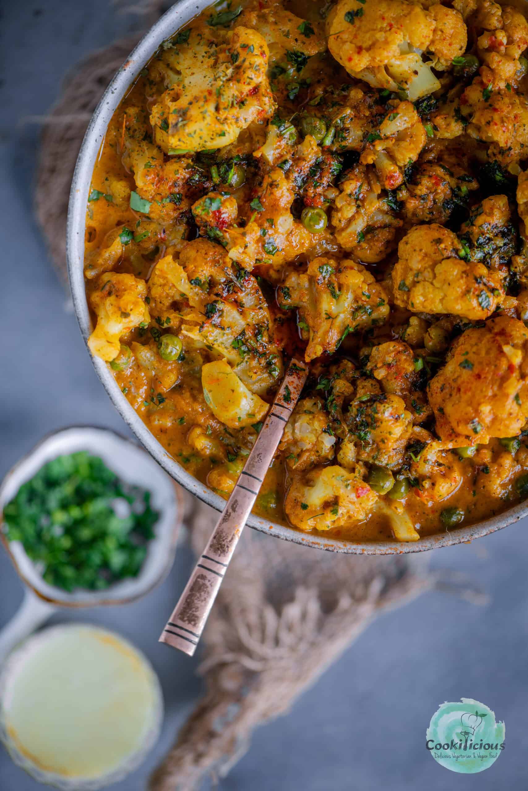 extreme close up image of Indian Cauliflower Tikka Masala curry.