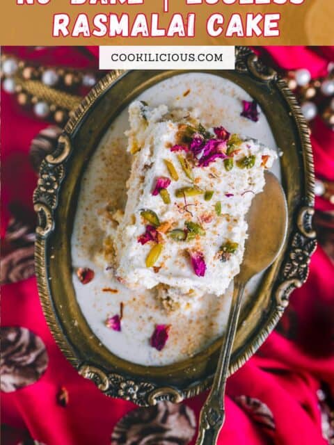 a slice of rasmalai cake served in an oval dish with a spoon in it and text at the top.