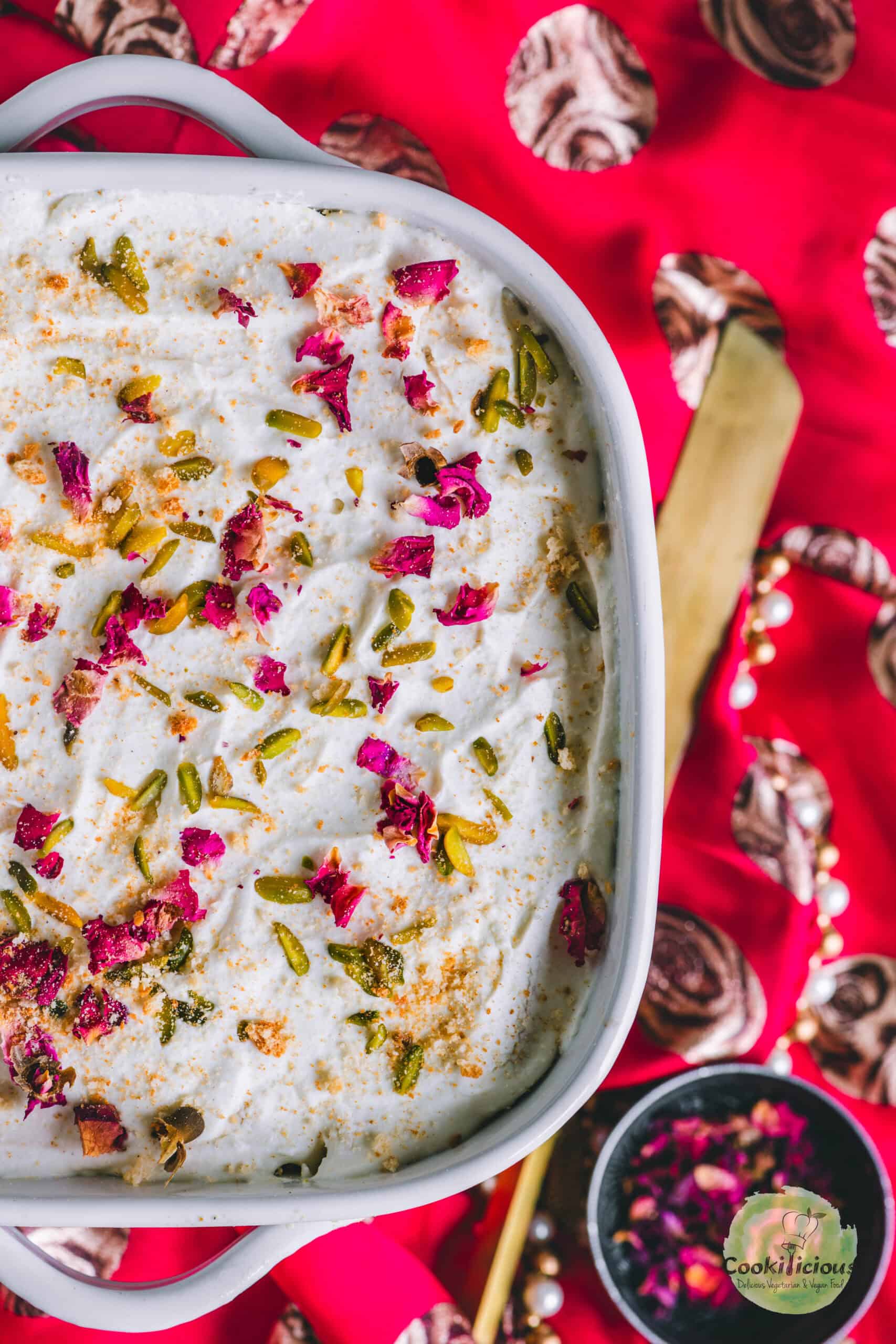 image of half a casserole of no-bake rasmalai cake.