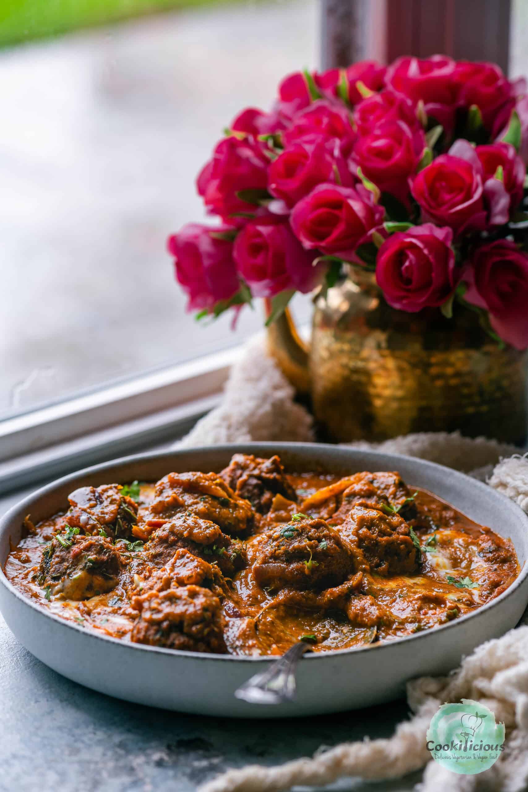 Vegan meatball curry served in a bowl.