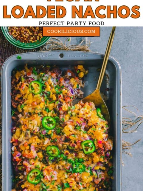 a spoon inside the tray of Vegan Loaded Nachos and text at the top.