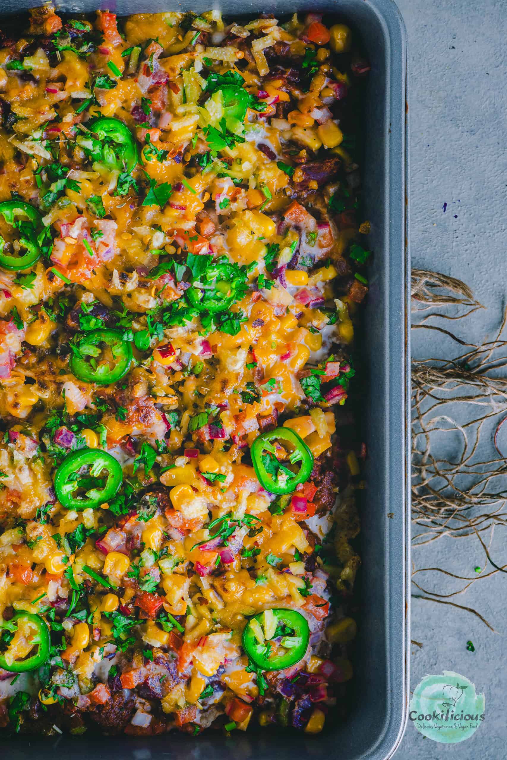 half tray of Vegan Loaded Nachos.