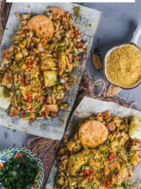 Authentic street-style Mumbai Bhel Puri served on two paper plates with Papdi and text at the top.