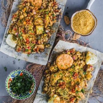 Authentic street-style Mumbai Bhel Puri served on two paper plates with Papdi.