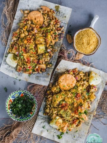 Authentic street-style Mumbai Bhel Puri served on two paper plates with Papdi.