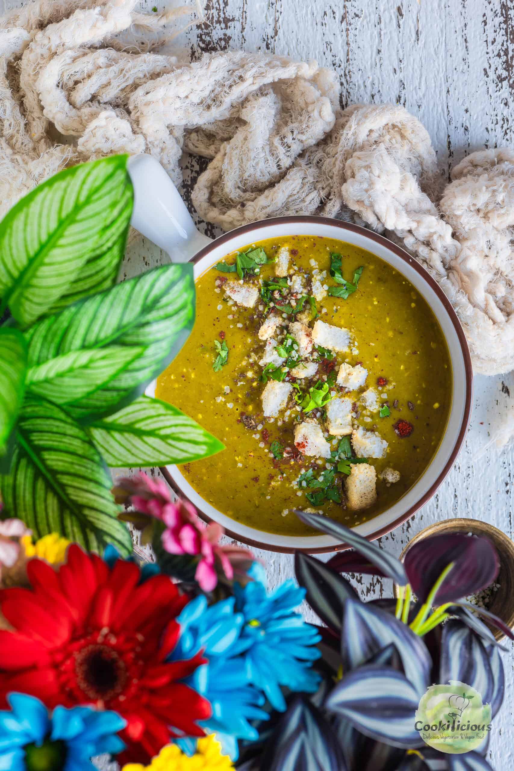 Dal Shorba served in a bowl garnished with croutons.