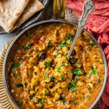 Khoya Matar served in a bowl with a spoon in it.