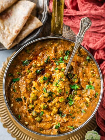 Khoya Matar served in a bowl with a spoon in it.