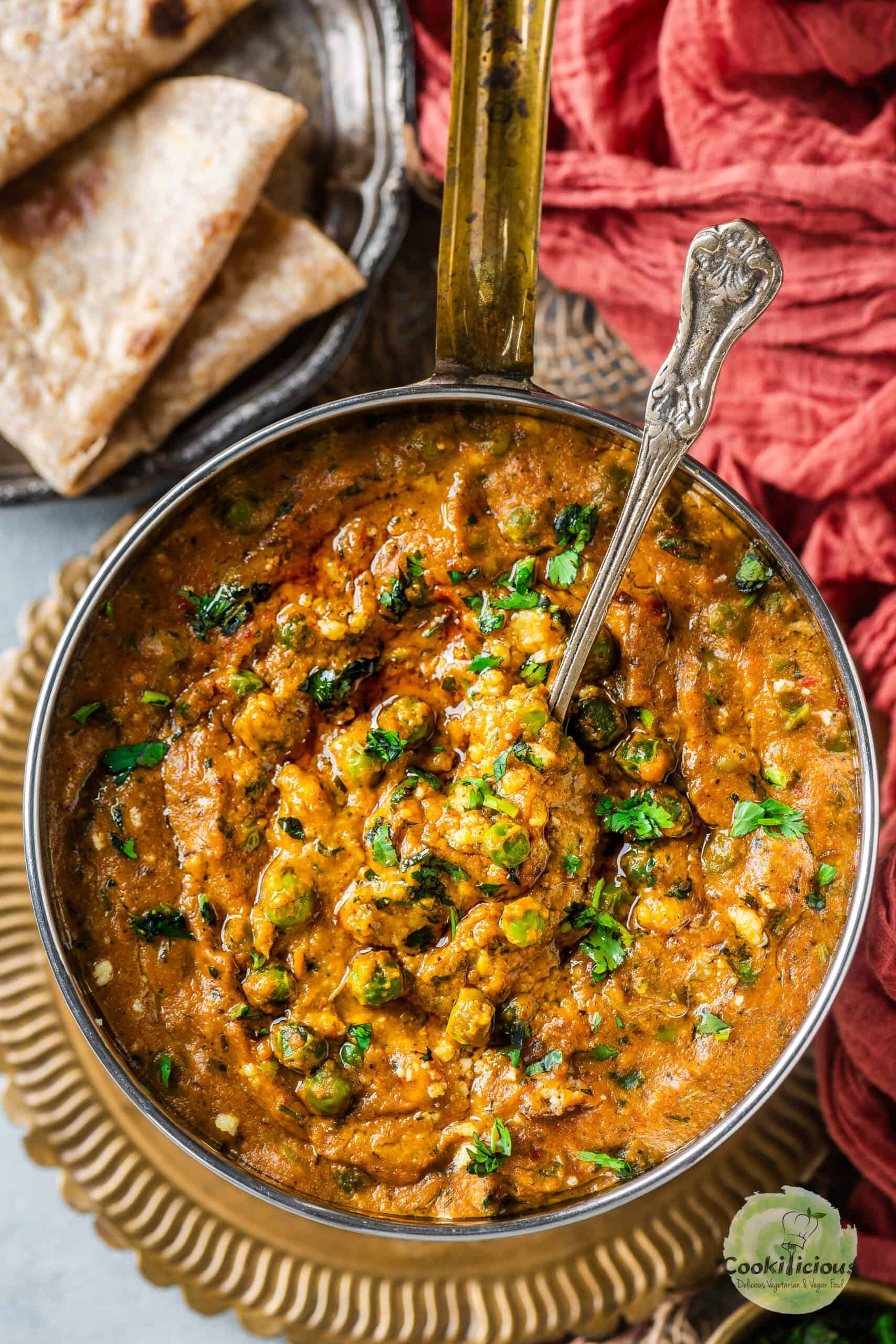 Khoya Matar served in a bowl with a spoon in it.