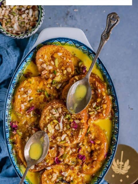 Shahi Tukda served on a plate with 2 spoons on it and text at the top.