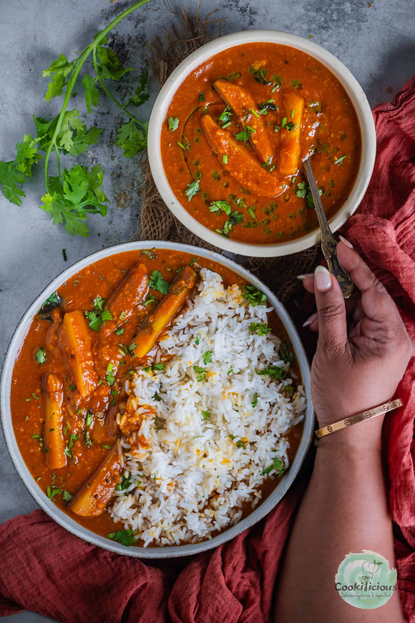 A bowl of Sindhi Kadhi placed next to a bowl of Kadhi Chawal.