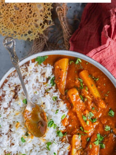 Sindhi Aloo Kadhi served with rice in a bowl and text at the top.