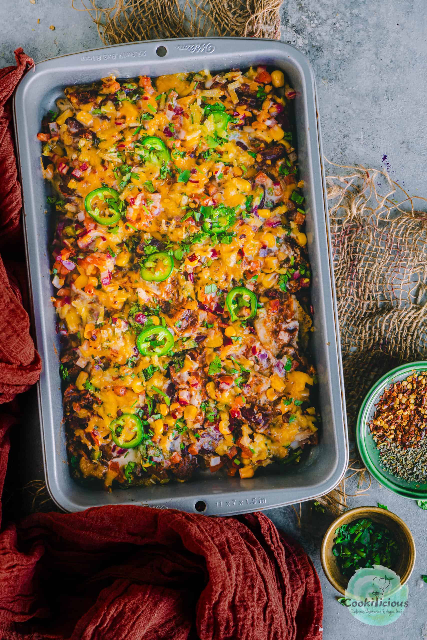 Vegan Loaded Nachos served in a tray.