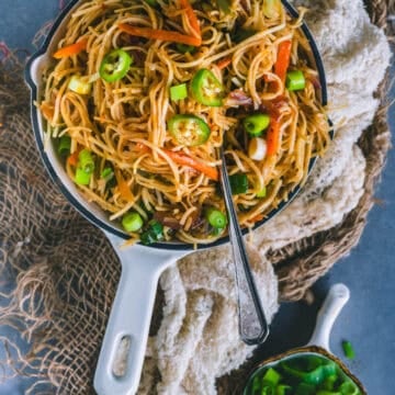 Veg Hakka Noodles served in a bowl with a fork in it.