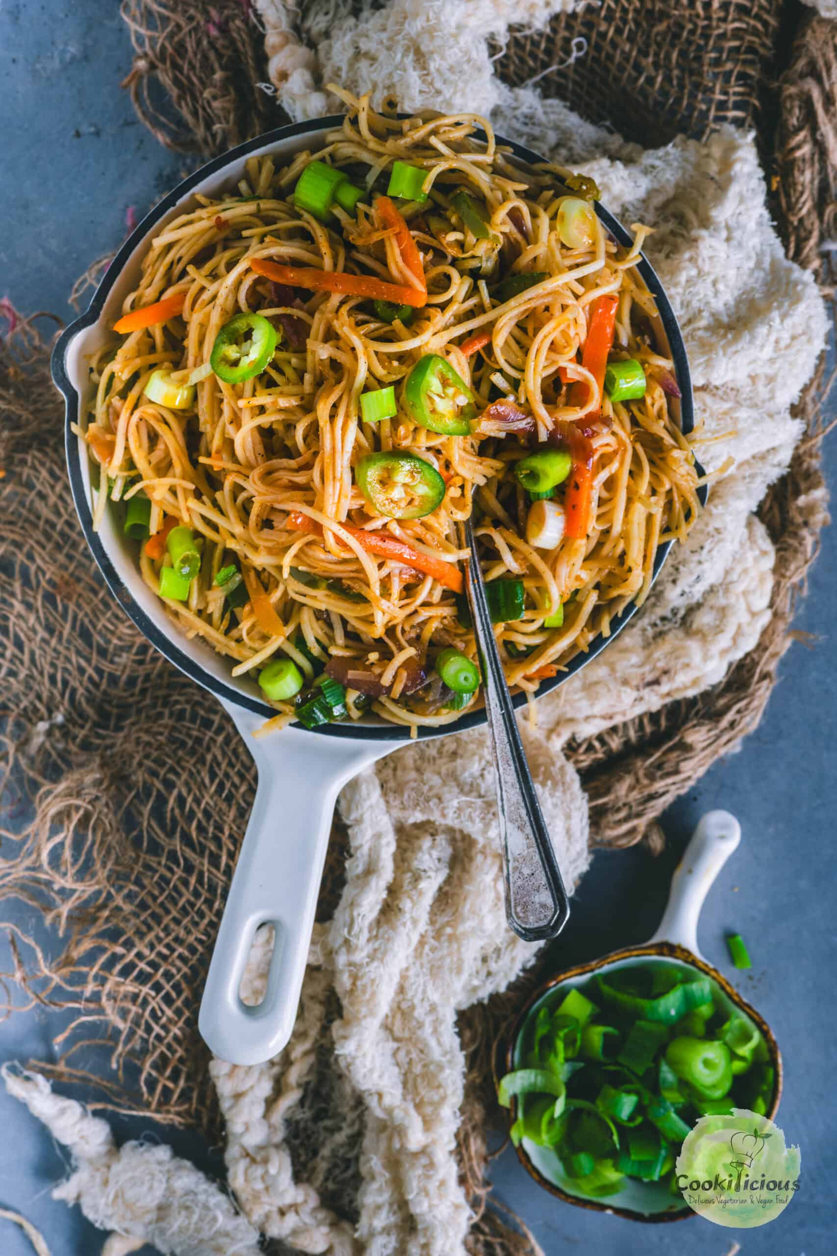 Veg Hakka Noodles served in a bowl with a fork in it.