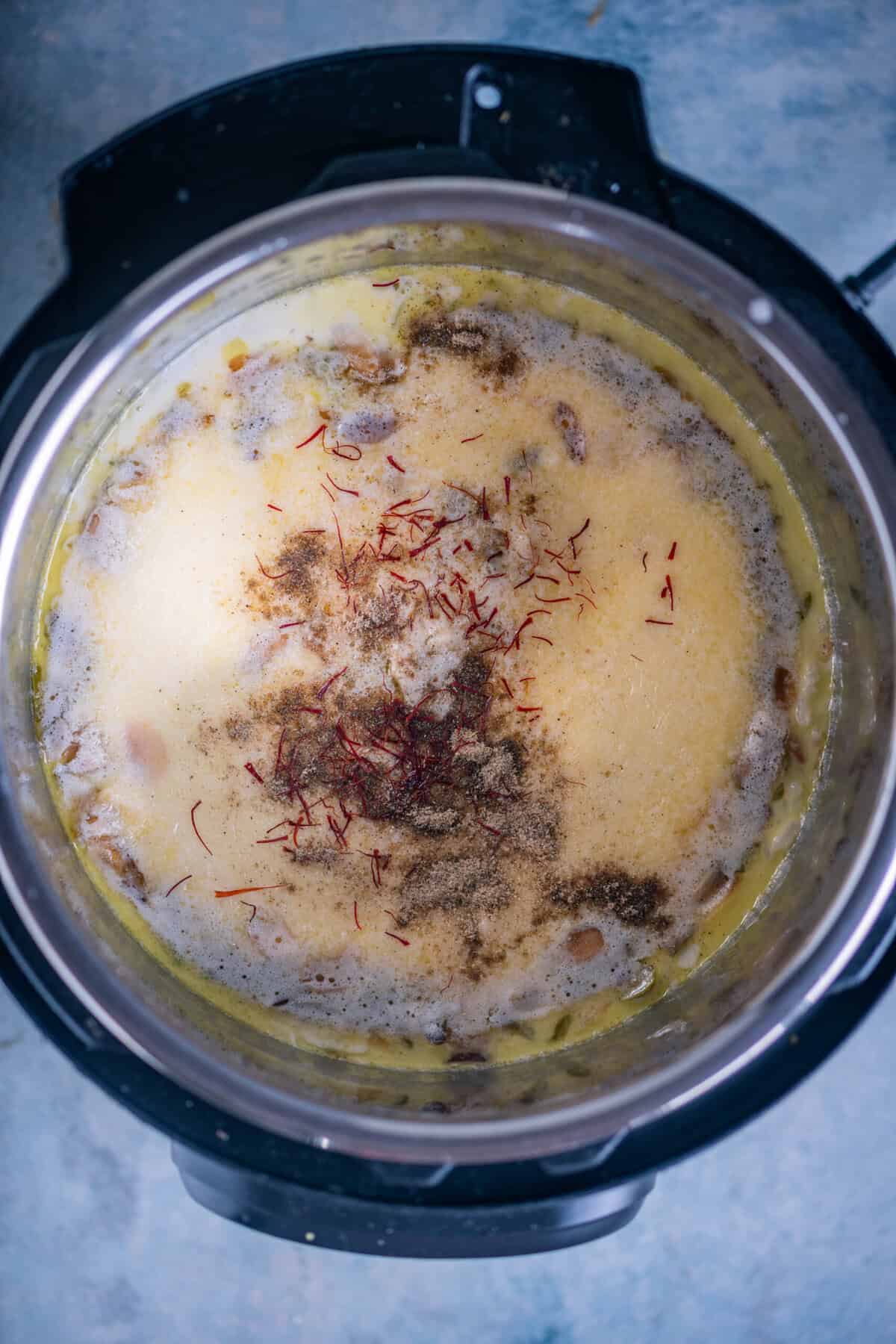 Cooked rice kheer mixed with saffron and cardamom.