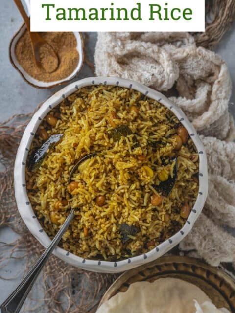 South Indian Tamarind Rice served with papad on the side and text at the top.