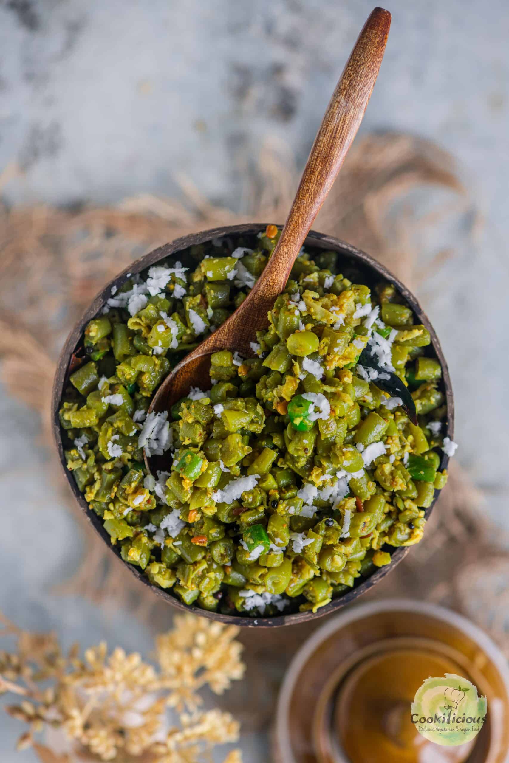 Beans Poriyal served in a bowl with a spoon in it.