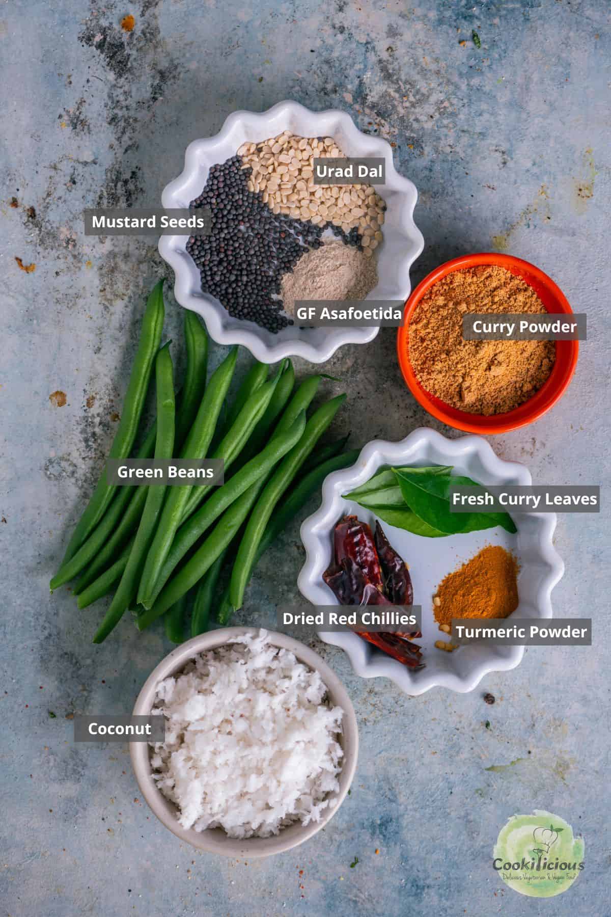 all the ingredients needed to make Indian Beans Poriyal with labels on them.