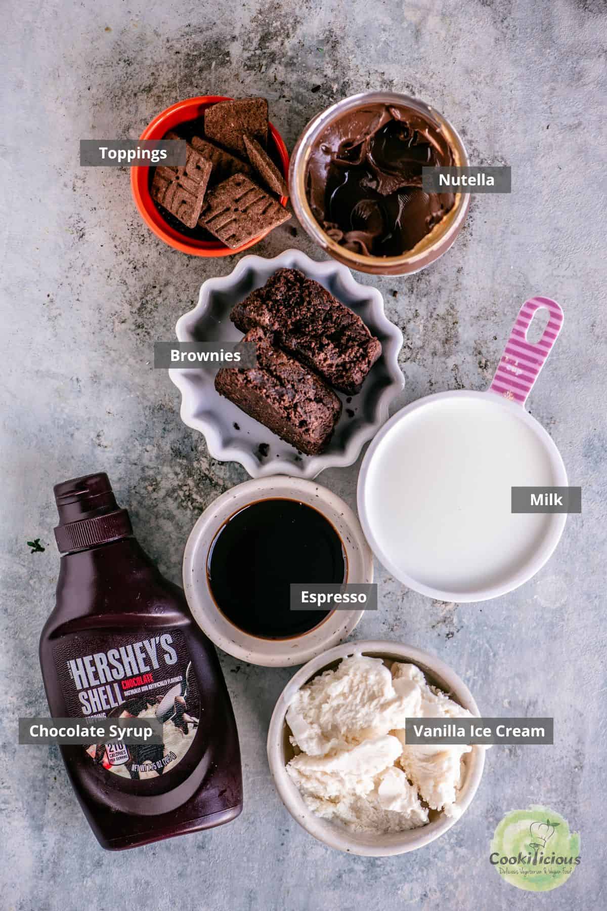 Ingredients for brownie milkshake arranged on a countertop with labels on them.