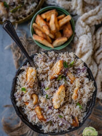 A bowl of fragrant Paneer Rice showcasing fluffy basmati rice and golden paneer cubes, served in a bowl.