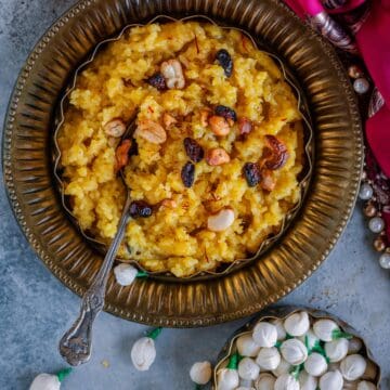 Tamil Sweet Pongal served in a bowl with a spoon in it.