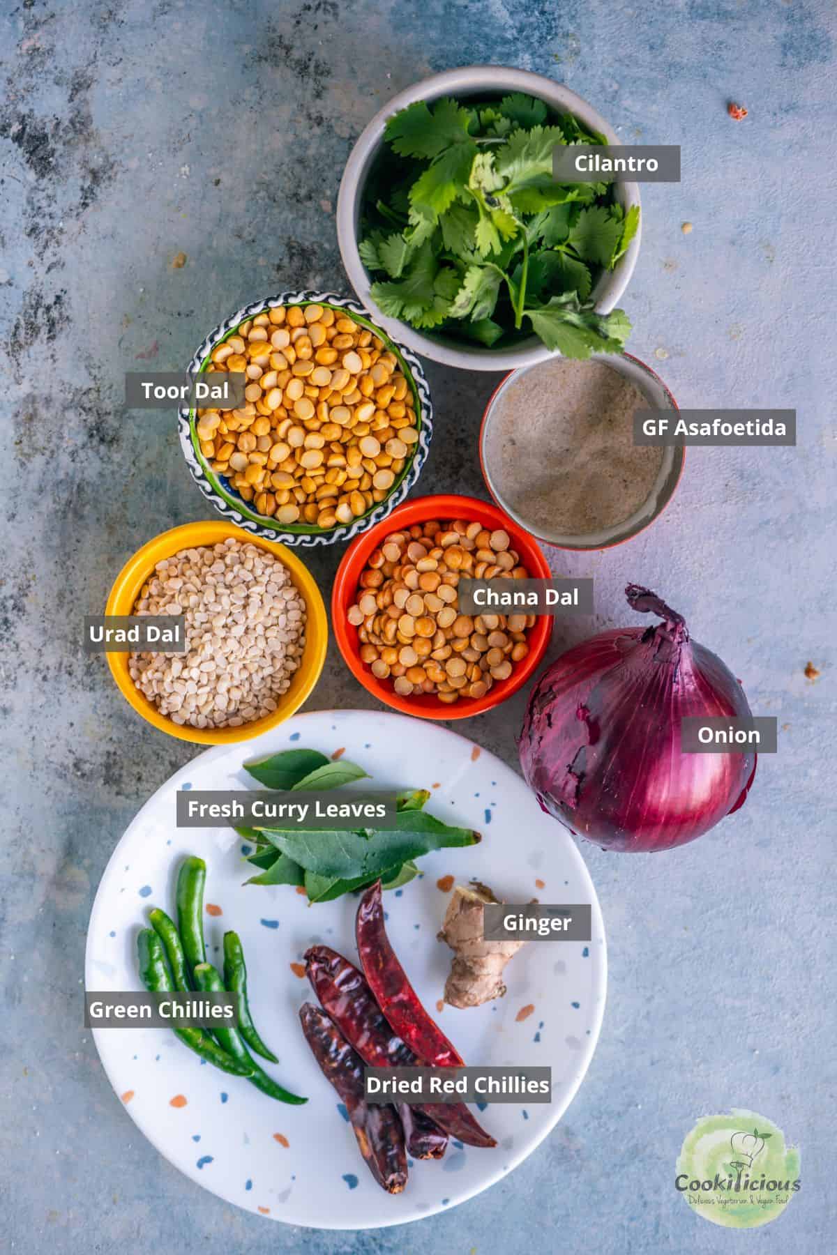 all the ingredients needed to make South Indian Dal Vada with labels on them.