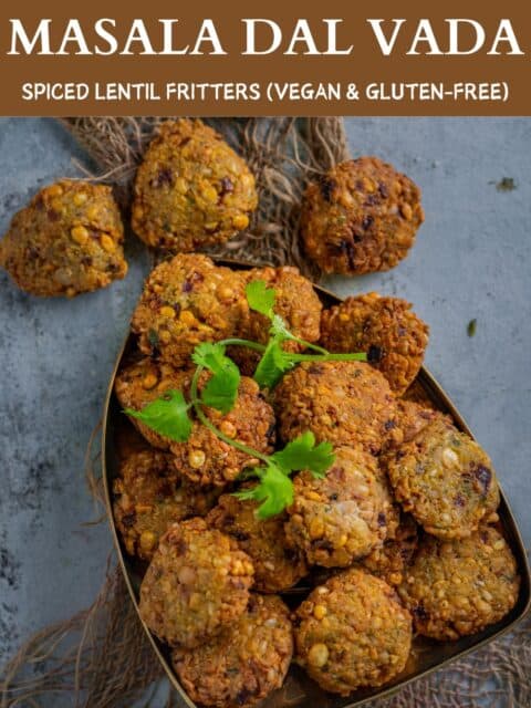 Golden-brown crispy dal vadas stacked on a plate, garnished with fresh cilantro and text at the top and bottom.