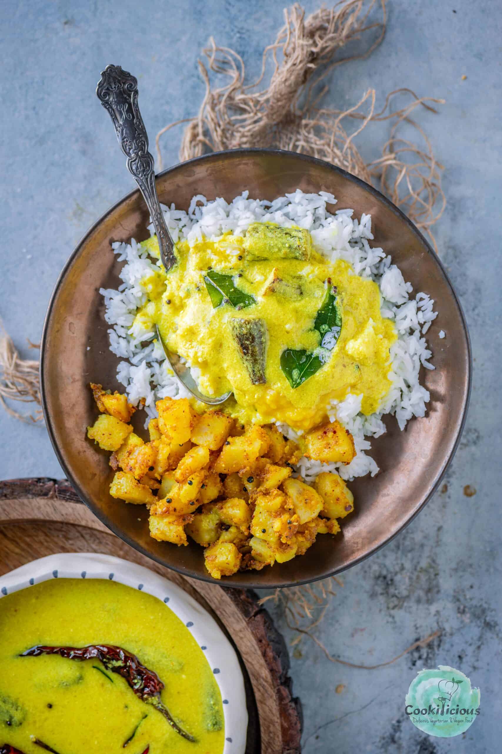 Vendakkai Mor Kuzhambu served with rice and potato fry.