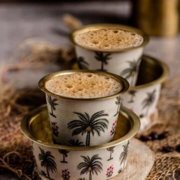 Madras Filter Coffee served in traditional tumbler set.