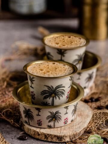 Madras Filter Coffee served in traditional tumbler set.