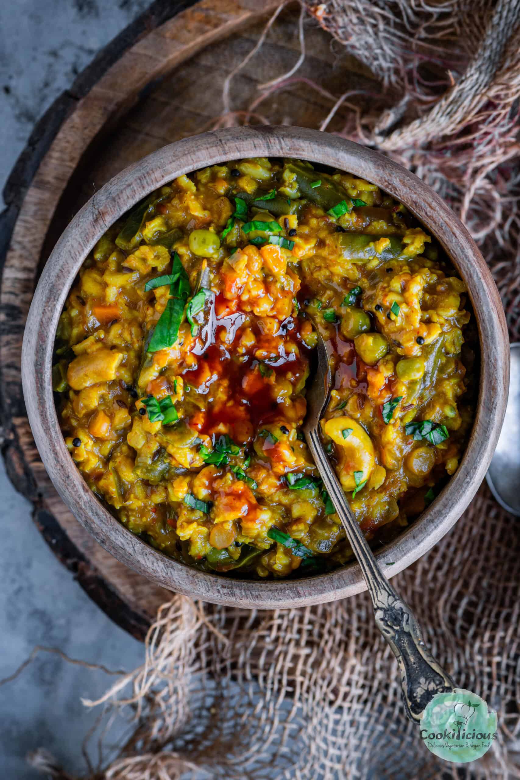 A top view of Instant Pot Oats Upma served with some ketchup in the middle.