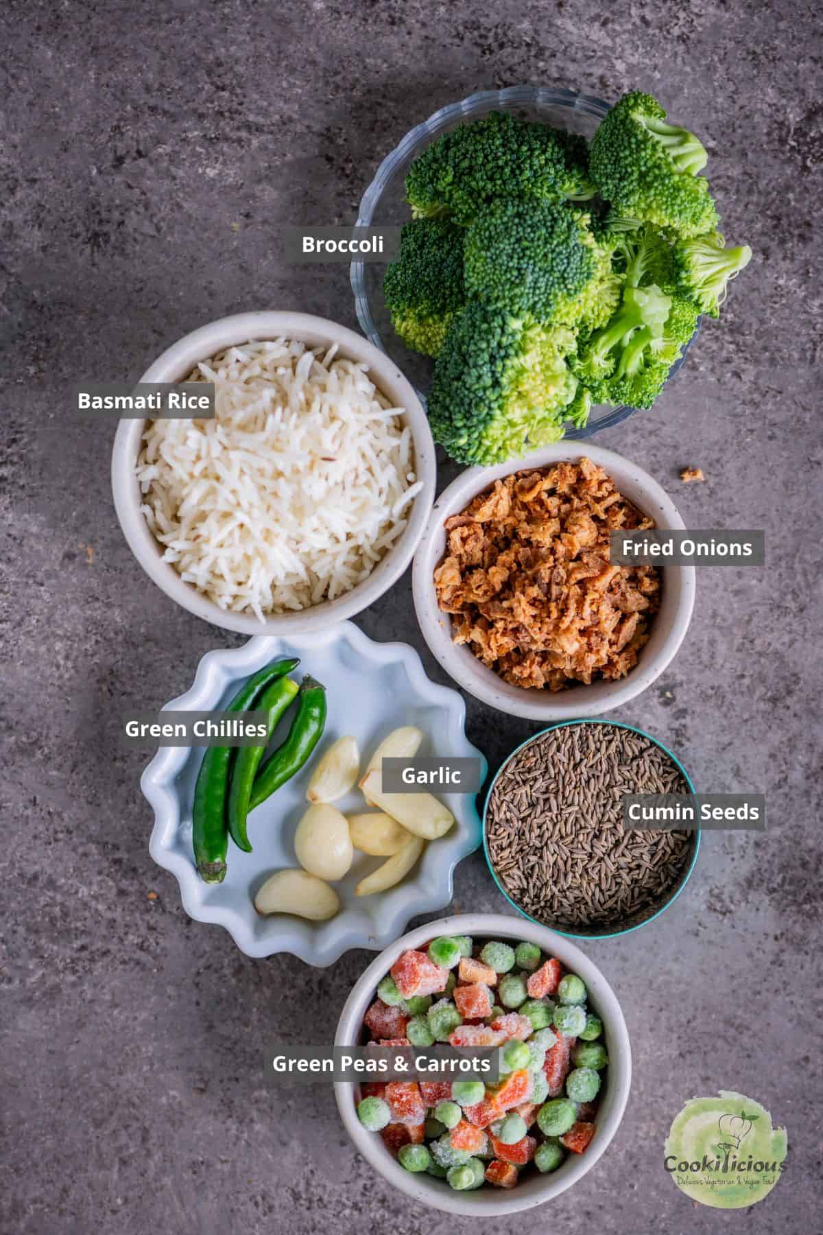 All ingredients needed to make vegan Broccoli fried rice placed on a table with labels on them.