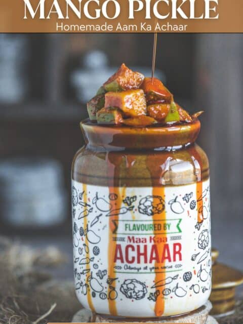 Homemade Mango Pickle stored in a Barni with text at the top and bottom.