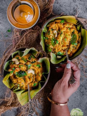 Tomato rava upma served hot in a bowl with vegetables, a classic South Indian breakfast.