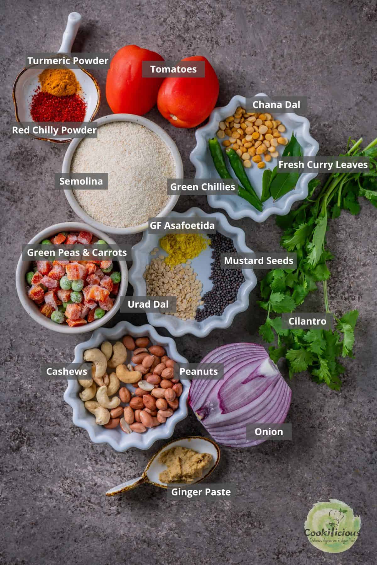All the ingredients needed to make tomato rava upma placed on a table with labels on them.
