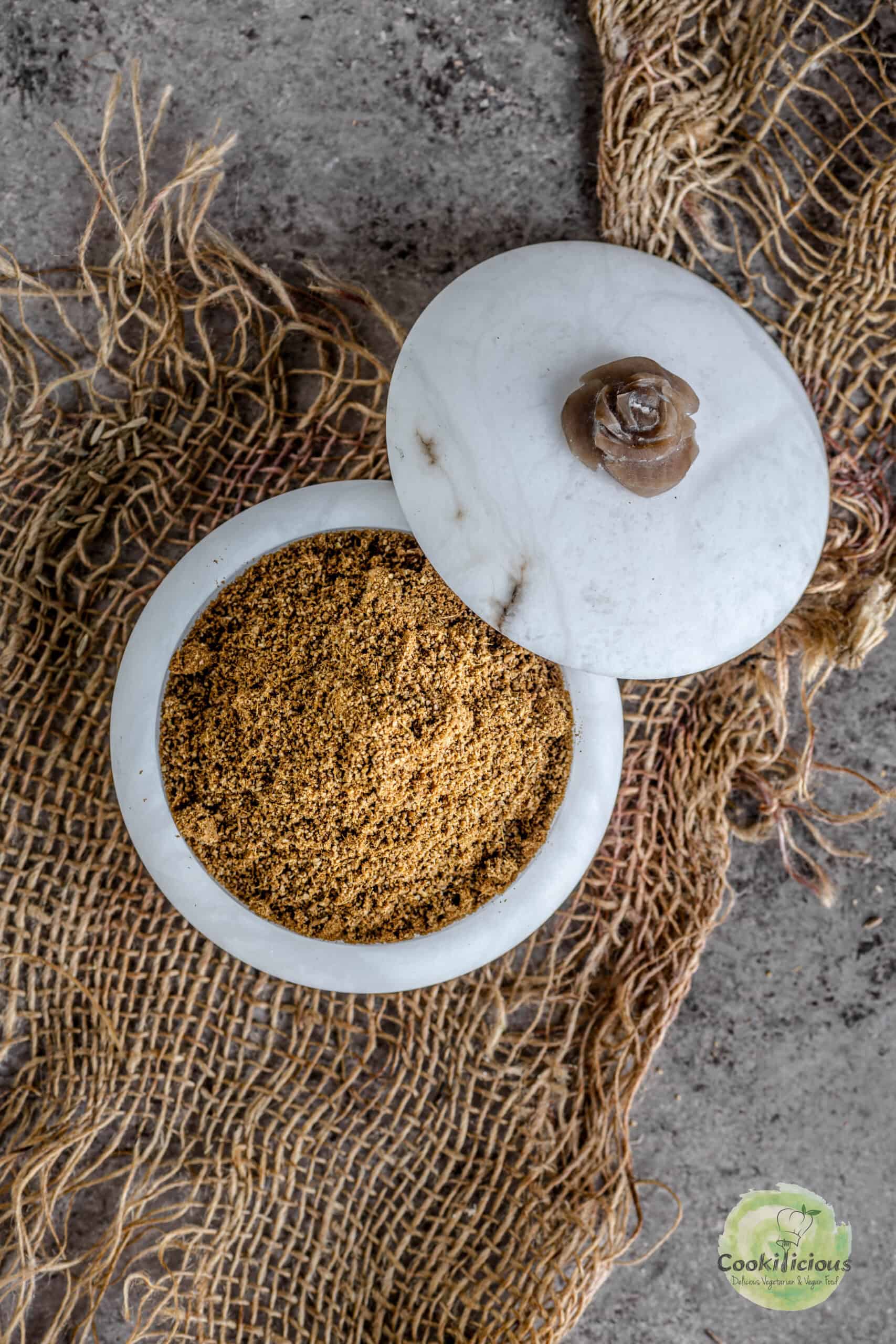 Roasted cumin powder served in a small box.