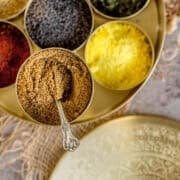 Cumin powder stored in an indian masala dabba along with other spices.