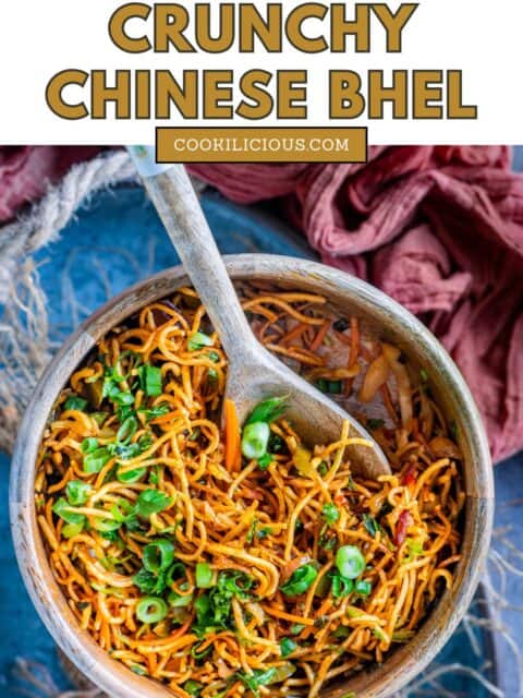 Indian crispy noodles salad served in a bowl with a spoon in it and text at the top and bottom.