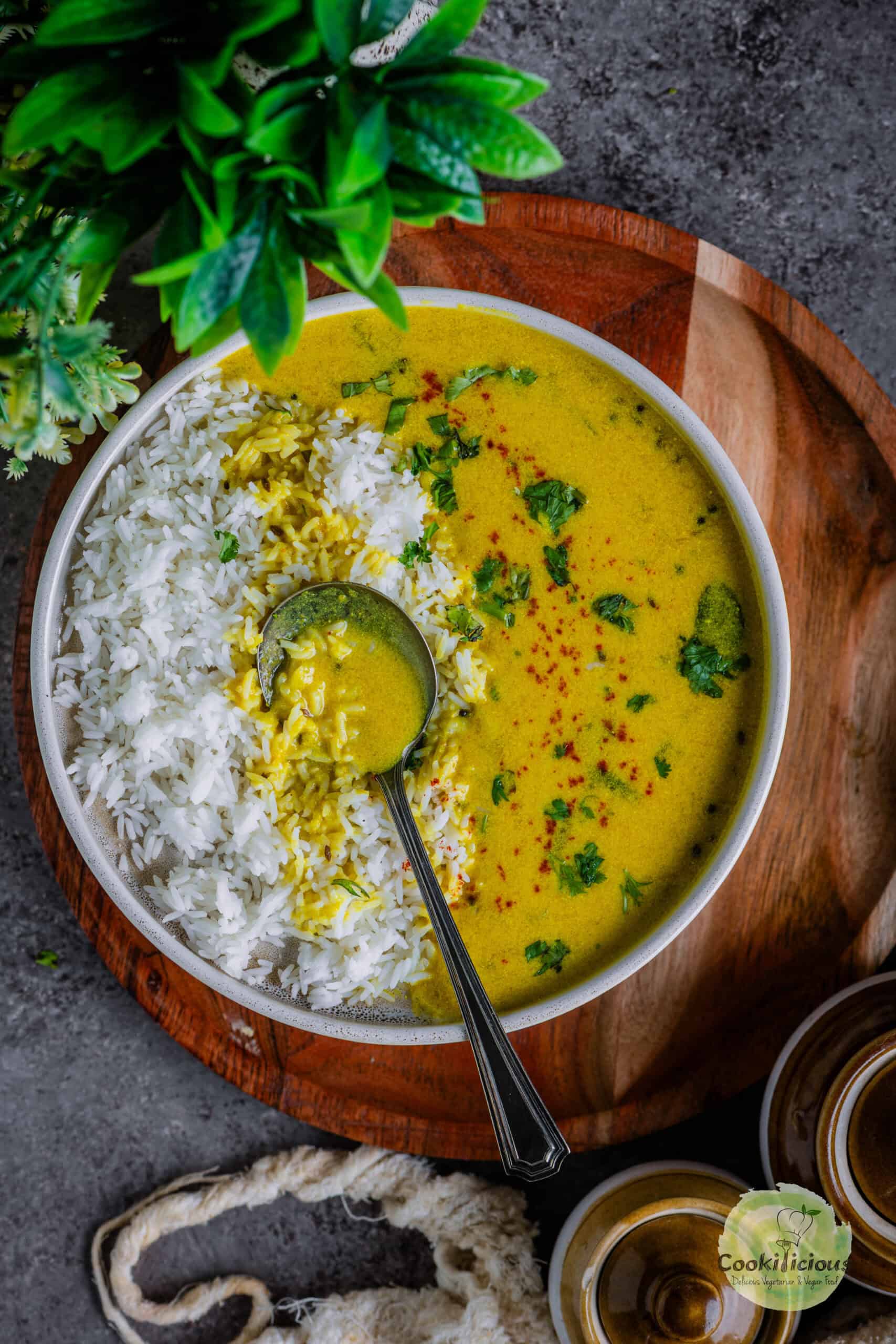 Gujarati kadhi chawal served in a plate.