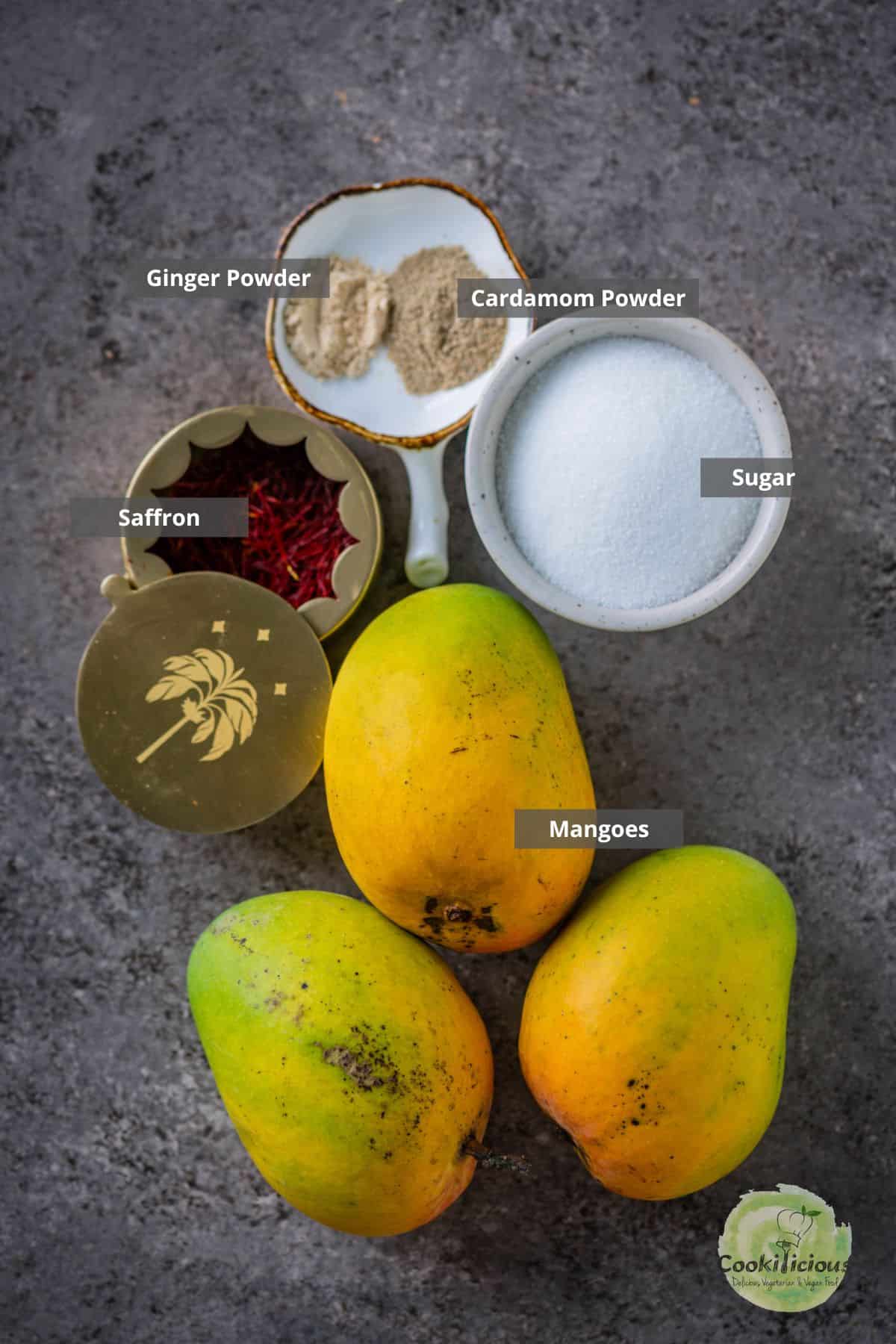 All the ingredients needed to make aamras placed on a table with labels on them.