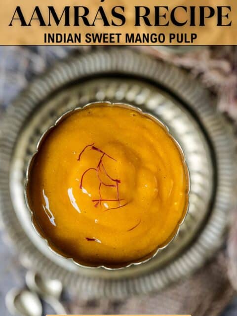Aamras - sweet mango pulp served in a round bowl with saffron garnished on top and text at the top and bottom.