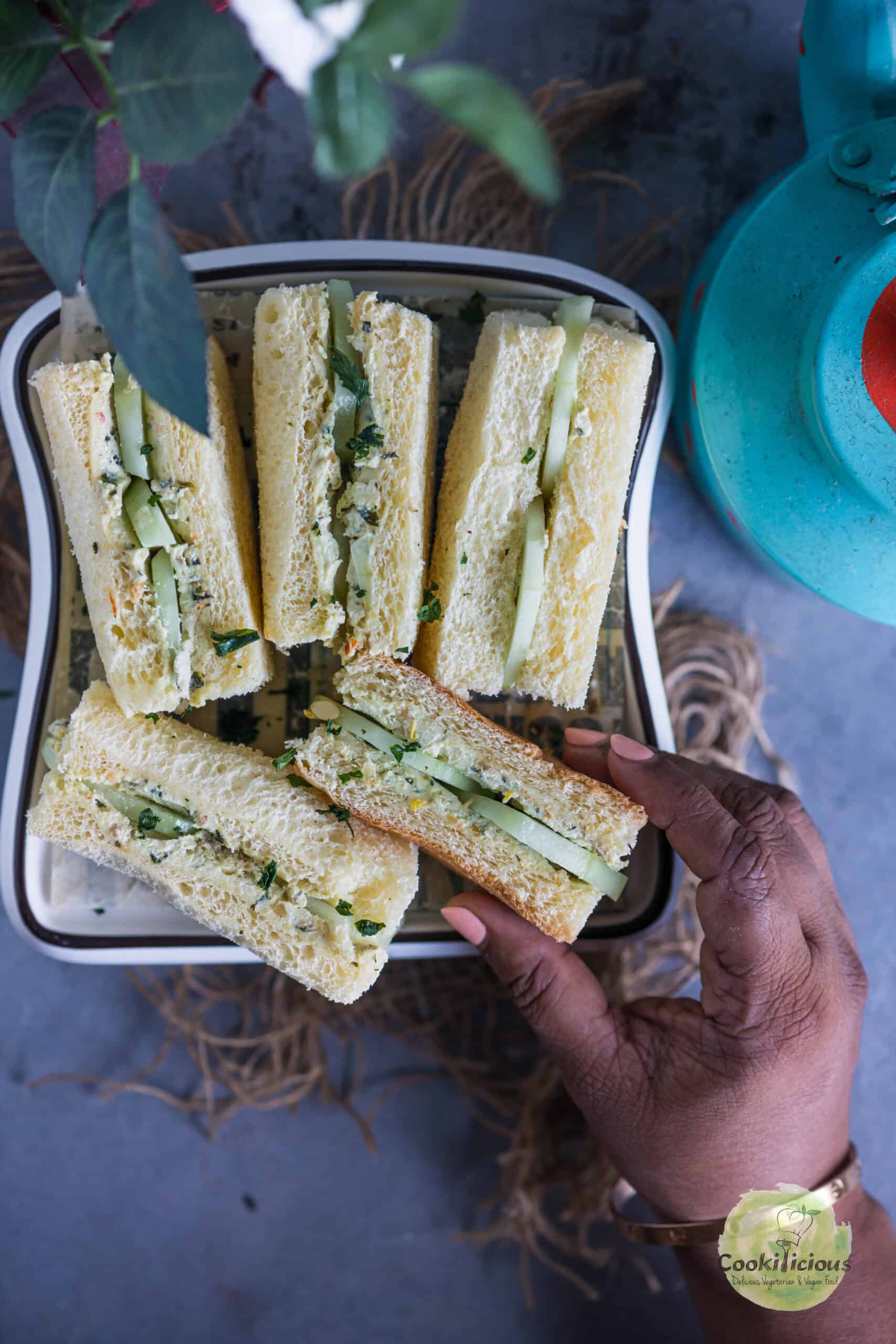Classic English tea-time cucumber and cream cheese sandwiches with crusts removed.