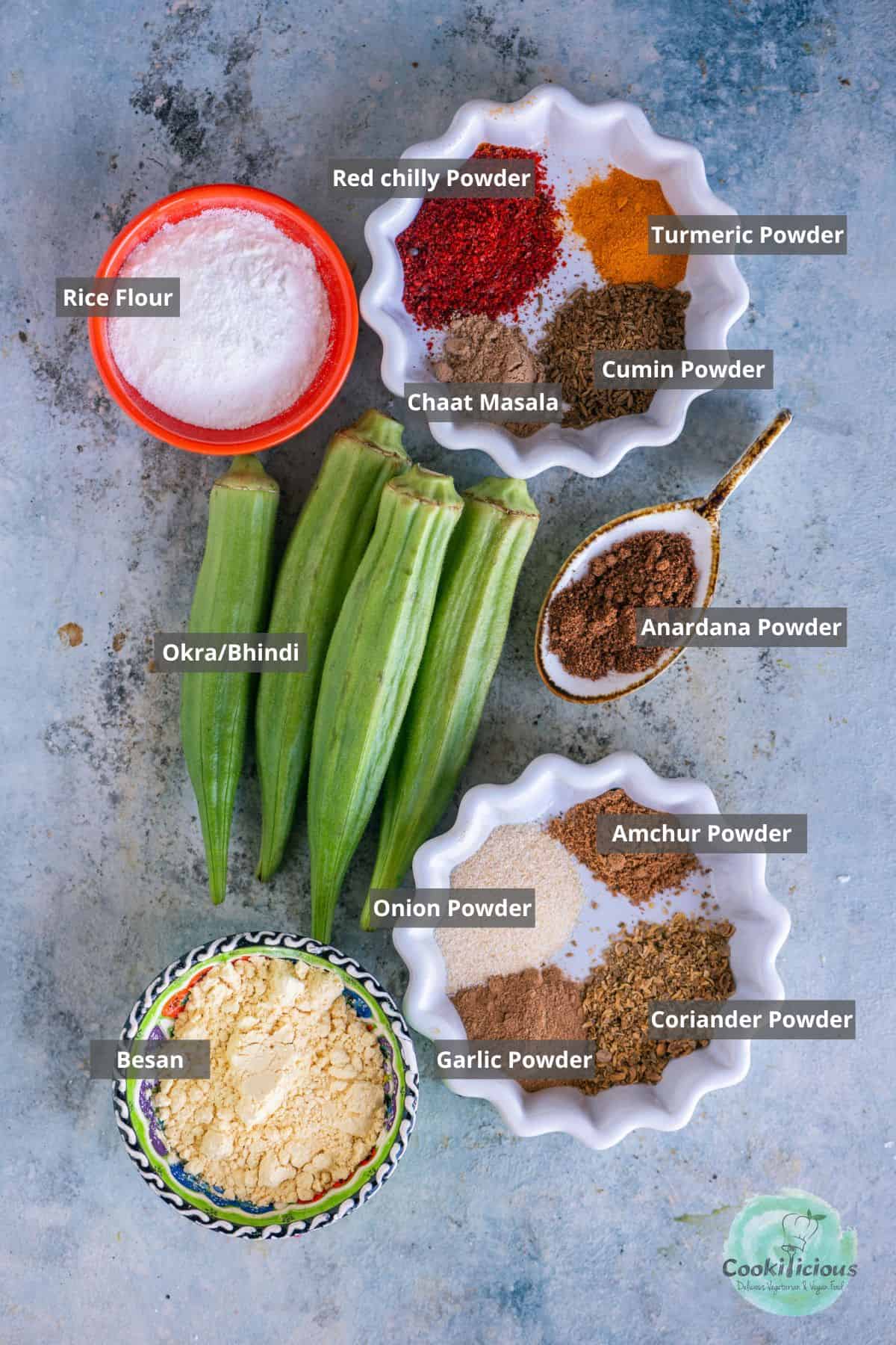 all the ingredients needed to make Kurkuri Bhindi in the Air Fryer placed on a table with labels on them.