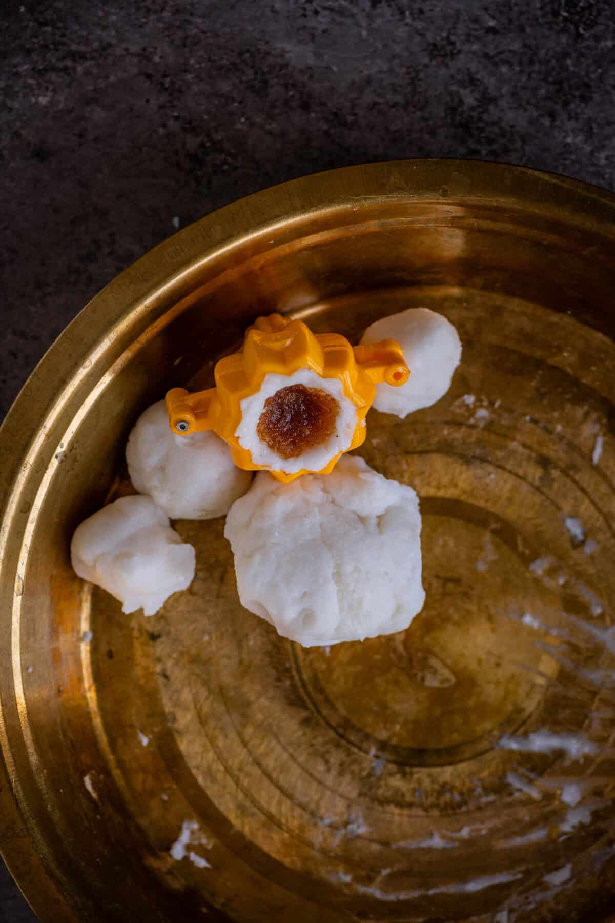 Thengai Pooranam filling stuffed into the dough cavity.