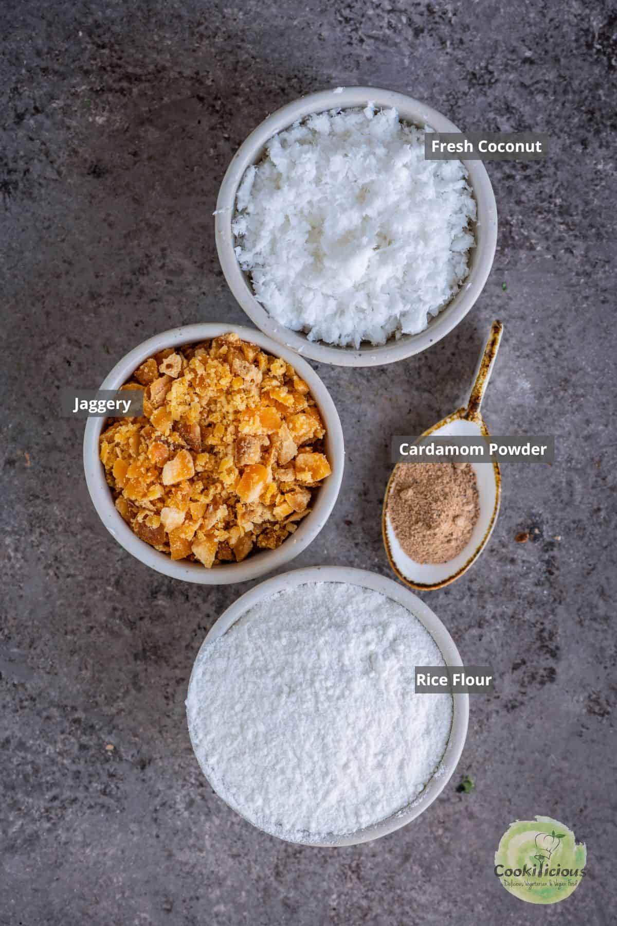 all the ingredients needed in the South Indian modak recipe placed on a table with labels on them.