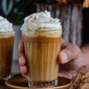 Vegan White Chocolate Mocha Latte topped with whipped cream and cinnamon.