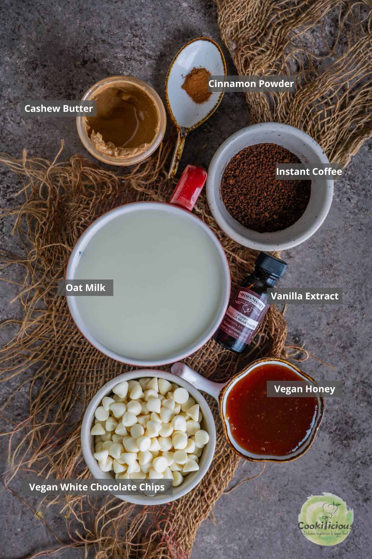 all the ingredients needed to make Starbucks copycat Mocha Latte placed on a table with labels on them.